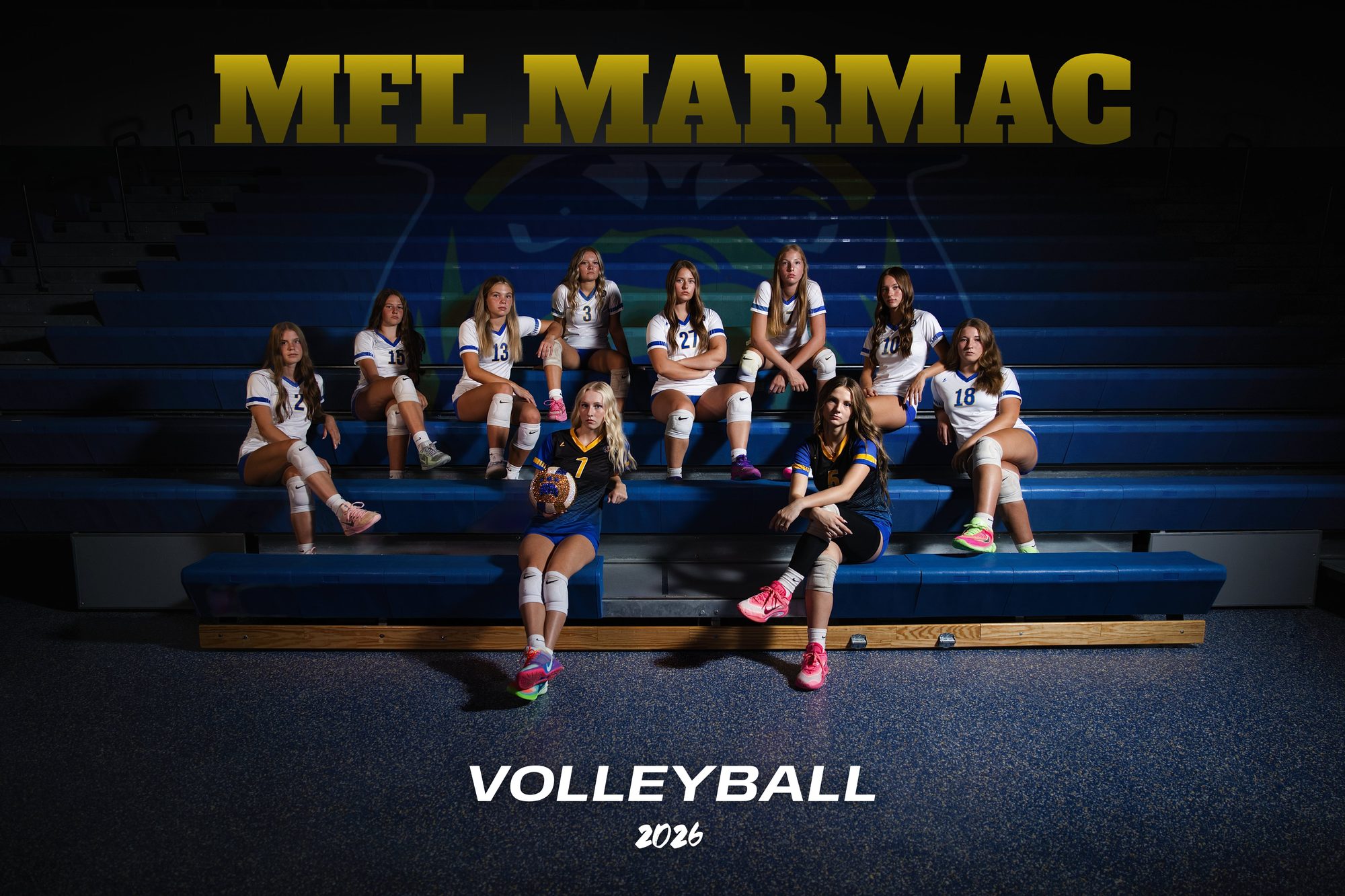 MFL MarMac volleyball team banner, 2026 — the roster posed across the gym bleachers under stage lighting